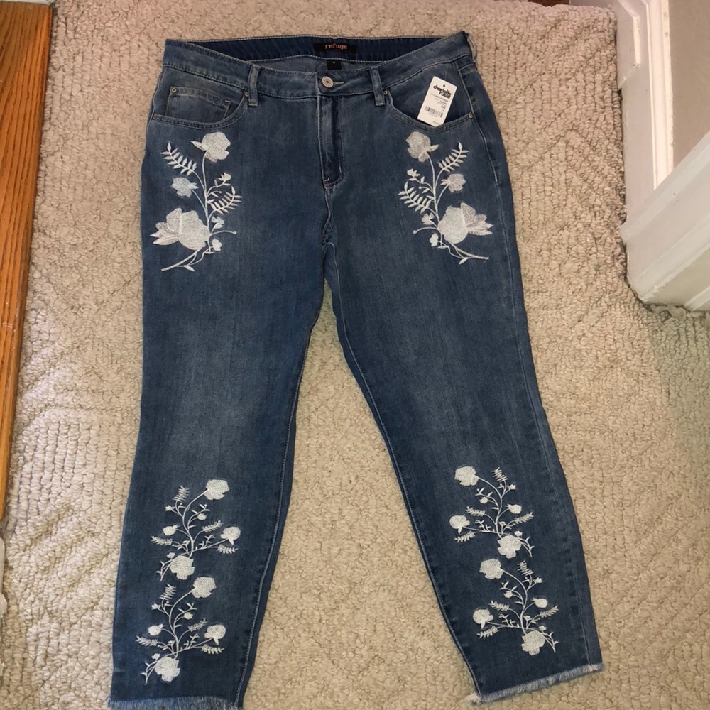 jeans with white floral detail & flared ends